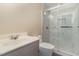 Bathroom featuring a walk-in shower with glass doors and vanity with sink at 3309 Westcott Cir, Sanford, NC 27330
