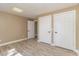 Neutral bedroom with wood-look flooring and two closets at 3309 Westcott Cir, Sanford, NC 27330
