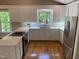 Well-lit kitchen featuring stainless steel appliances, white cabinetry, and light countertops at 3309 Westcott Cir, Sanford, NC 27330