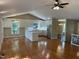 Bright kitchen with stainless steel appliances, white cabinets, and hardwood floors at 3309 Westcott Cir, Sanford, NC 27330