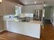 Modern kitchen with stainless steel appliances, white cabinets, and stylish countertops at 3309 Westcott Cir, Sanford, NC 27330