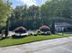 Community pool with mature trees, lush landscaping, and surrounding greenery at 3309 Westcott Cir, Sanford, NC 27330