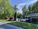 Community pool area with landscaped grounds, mature trees, and a gated entrance for resident enjoyment at 3309 Westcott Cir, Sanford, NC 27330