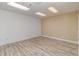 Large room with wood-look flooring and neutral paint at 3309 Westcott Cir, Sanford, NC 27330