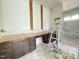 Bathroom featuring marble floors, white walls, dark wood cabinets, a vanity, and a step ladder at 2633 Trifle Ln, Wake Forest, NC 27587