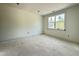 Bright bedroom with fresh white paint and large windows offering natural light at 2633 Trifle Ln, Wake Forest, NC 27587