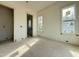 Bedroom with light walls, a window overlooking the yard, and doorway access to an adjacent room at 2633 Trifle Ln, Wake Forest, NC 27587