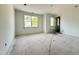 Spacious bedroom with two large windows providing natural light and backyard views at 2633 Trifle Ln, Wake Forest, NC 27587