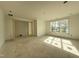 Spacious bedroom with bright walls, a large window overlooking the yard, and doorway access to another room at 2633 Trifle Ln, Wake Forest, NC 27587