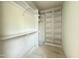 Walk-in closet providing ample storage with built-in shelving and modern design at 2633 Trifle Ln, Wake Forest, NC 27587