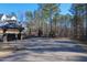 Community entrance with covered mailboxes, landscaping and view to homes and nature path at 2633 Trifle Ln, Wake Forest, NC 27587