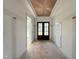 Entryway with a striking wood-paneled ceiling, a dark front door, and bright walls at 2633 Trifle Ln, Wake Forest, NC 27587