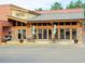 Image of Over the Falls with outdoor seating, stone accents, and an inviting entrance at 2633 Trifle Ln, Wake Forest, NC 27587