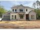 New two story home with gray and white accents, black window frames, and attached two car garage at 2633 Trifle Ln, Wake Forest, NC 27587