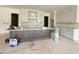 Modern kitchen featuring white cabinets, a large island with gray trim, and stainless steel appliances at 2633 Trifle Ln, Wake Forest, NC 27587