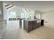 Gourmet kitchen featuring dark wood island with farmhouse sink, pendant lighting, and stainless appliances at 2633 Trifle Ln, Wake Forest, NC 27587