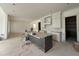 Modern kitchen featuring white cabinets, a large island with gray trim, and stainless steel appliances at 2633 Trifle Ln, Wake Forest, NC 27587
