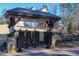 Community mailboxes featuring a covered structure with stone accents and reserved parking at 2633 Trifle Ln, Wake Forest, NC 27587