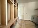 Organized mudroom offering built-in cubbies, bench seating, and cabinet storage for convenience at 2633 Trifle Ln, Wake Forest, NC 27587
