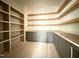 Spacious pantry with wooden shelving, gray base cabinets, and ample storage space at 2633 Trifle Ln, Wake Forest, NC 27587