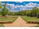 A beautifully landscaped park with walking paths, green spaces, and manicured trees at 2633 Trifle Ln, Wake Forest, NC 27587