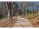 A gravel path meanders through a wooded area, offering a peaceful walking experience at 2633 Trifle Ln, Wake Forest, NC 27587
