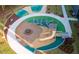 Aerial view of modern playground with colorful, innovative play structures and safety surfaces at 2633 Trifle Ln, Wake Forest, NC 27587
