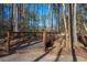 Scenic wooden bridge with a view of the trees and pond. A serene and tranquil water view at 2633 Trifle Ln, Wake Forest, NC 27587