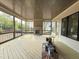 Screened porch with a stone fireplace, perfect for outdoor relaxation and entertainment at 2633 Trifle Ln, Wake Forest, NC 27587