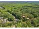 The property has a lush, wooded landscape, perfect for building a secluded home in a natural setting at 2332 Windy Woods Dr, Raleigh, NC 27607