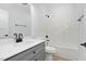 Clean bathroom with gray vanity and bathtub at 329 Roxboro St, Haw River, NC 27258