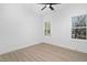 Spacious bedroom with wood-look floors and two windows at 329 Roxboro St, Haw River, NC 27258