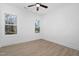 Well-lit bedroom with ceiling fan and wood-look floors at 329 Roxboro St, Haw River, NC 27258