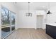 Bright dining area with sliding glass doors to backyard at 329 Roxboro St, Haw River, NC 27258