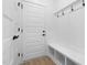 Functional entryway with bench and coat hooks at 329 Roxboro St, Haw River, NC 27258