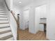 Clean hallway with light wood floors and built-in shelving at 329 Roxboro St, Haw River, NC 27258