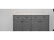 Modern laundry room featuring gray cabinets and countertop at 329 Roxboro St, Haw River, NC 27258