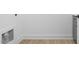 Bright laundry room with gray cabinets and vinyl flooring at 329 Roxboro St, Haw River, NC 27258