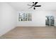 Spacious living room with sliding glass doors and ceiling fan at 329 Roxboro St, Haw River, NC 27258