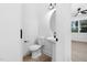 Stylish bathroom with pedestal sink and round mirror at 331 Roxboro St, Haw River, NC 27258