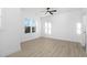 Bright bedroom with ceiling fan and hardwood floors at 331 Roxboro St, Haw River, NC 27258