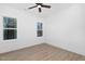 Bright bedroom with wood flooring and ceiling fan at 331 Roxboro St, Haw River, NC 27258