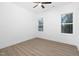 Well-lit bedroom with wood flooring and ceiling fan at 331 Roxboro St, Haw River, NC 27258