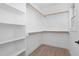 Spacious walk-in closet with shelving and hanging rods at 331 Roxboro St, Haw River, NC 27258