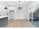 Light-filled dining area with sliding glass door access to backyard at 331 Roxboro St, Haw River, NC 27258