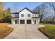 Modern duplex with two-car garages and a shared driveway at 331 Roxboro St, Haw River, NC 27258