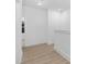 Bright hallway with light wood flooring and access to other rooms at 331 Roxboro St, Haw River, NC 27258