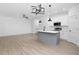 Modern kitchen with island and stainless steel appliances at 331 Roxboro St, Haw River, NC 27258