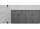 Laundry room with gray cabinets and countertop at 331 Roxboro St, Haw River, NC 27258