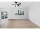 Spacious living room with large windows and light wood flooring at 331 Roxboro St, Haw River, NC 27258